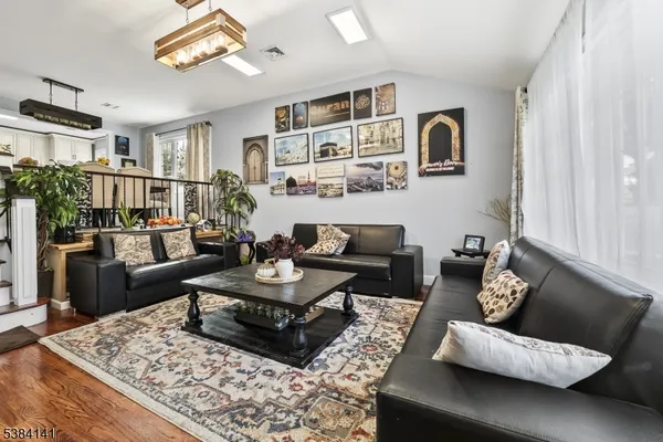 a living room with furniture rug and window