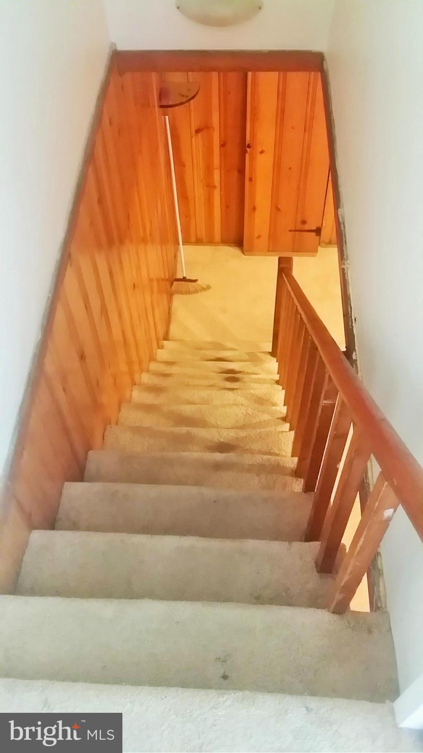 6939 Glenheights Road Baltimore, MD 21215 - Photo 16 of 21 a view of staircase with white walls