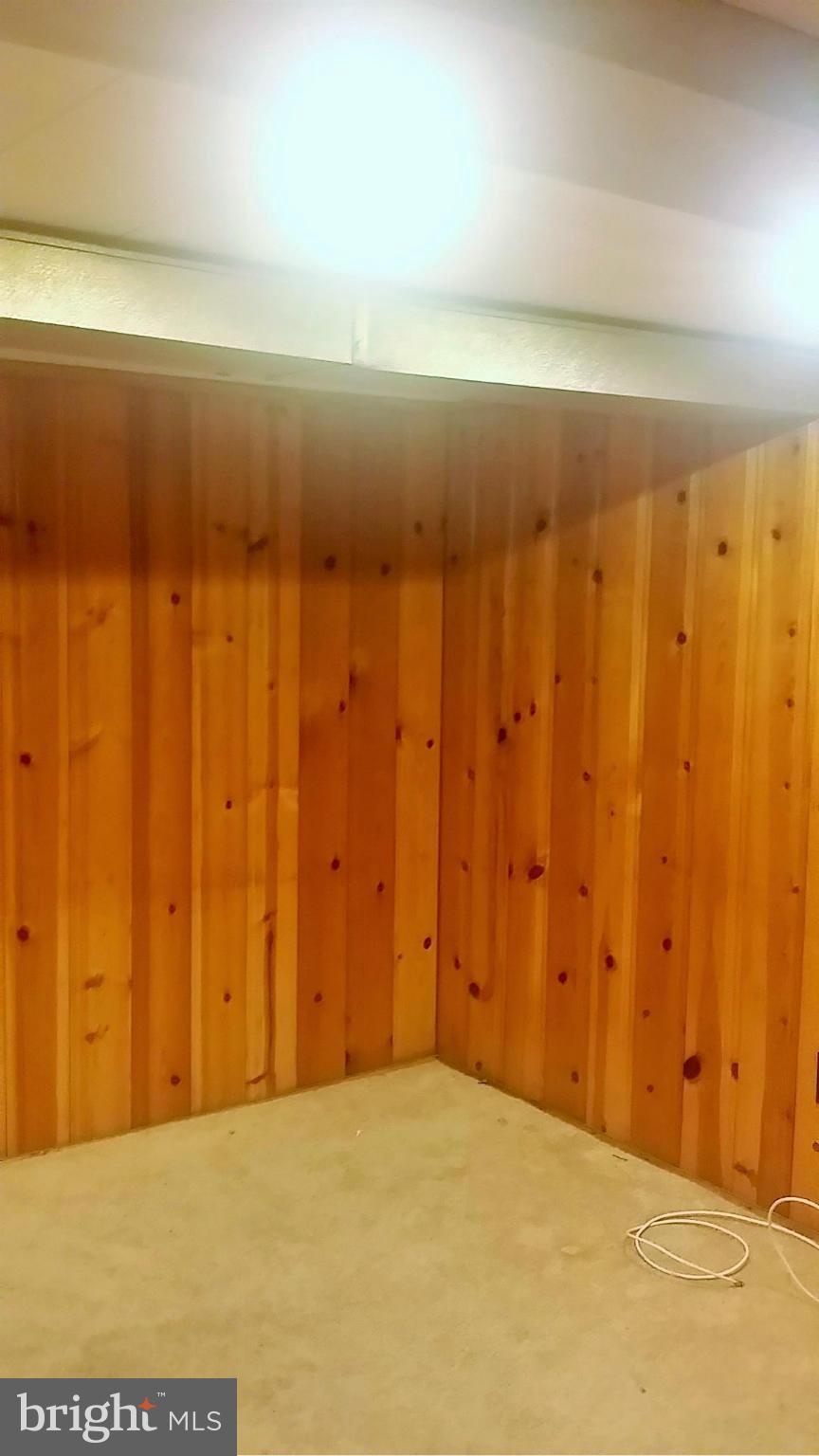 6939 Glenheights Road Baltimore, MD 21215 - Photo 17 of 21 a view of wooden floor and chair in a room