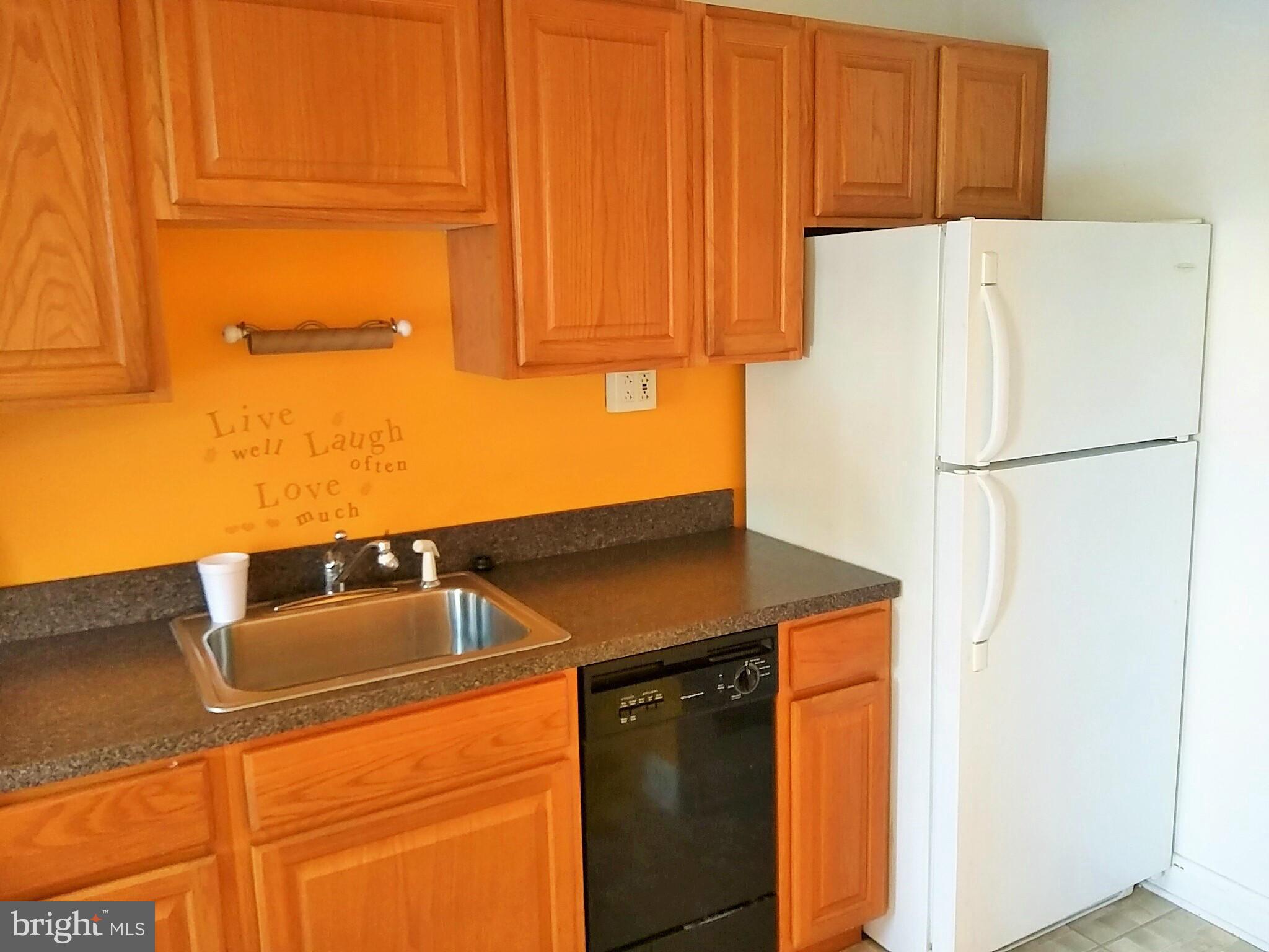 6939 Glenheights Road Baltimore, MD 21215 - Photo 9 of 21 a kitchen with stainless steel appliances a refrigerator and a sink