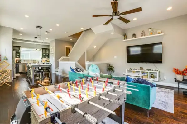 a living room with furniture and a flat screen tv