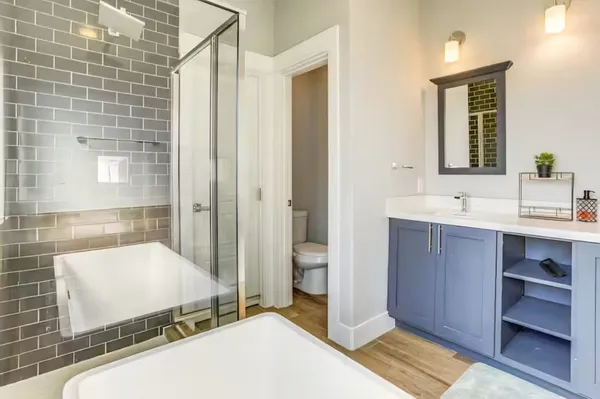 a bedroom with a bed and a table in it with window