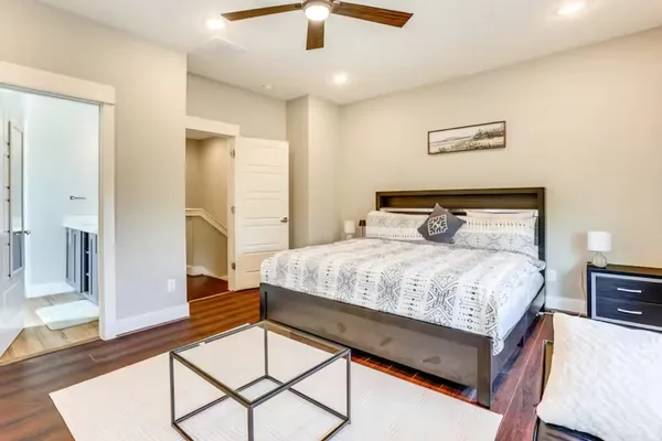 a bedroom with a bed and glass window