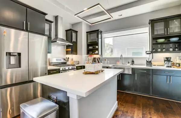 a kitchen with a sink cabinets and stainless steel appliances