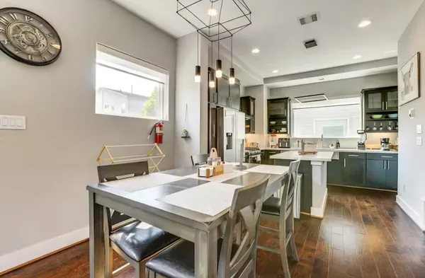 a view of a dining room with furniture window and wooden floor