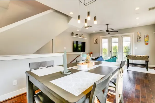 a view of a dining room with furniture window and wooden floor