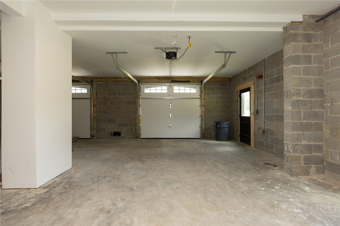 790 Howard Edmisten Road Sugar Grove, NC 28679 - Photo 30 of 45 a view of a hallway with a chandelier