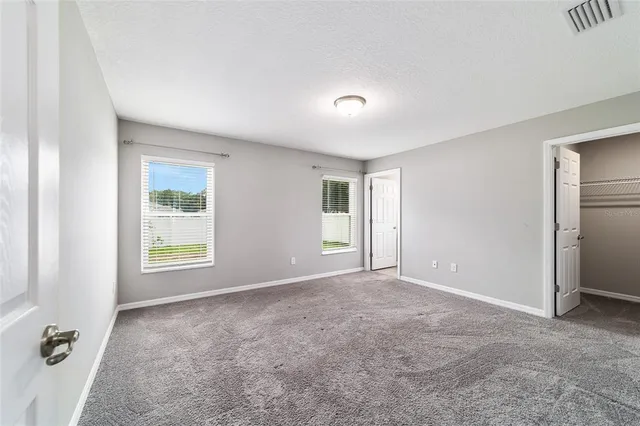 an empty room with windows