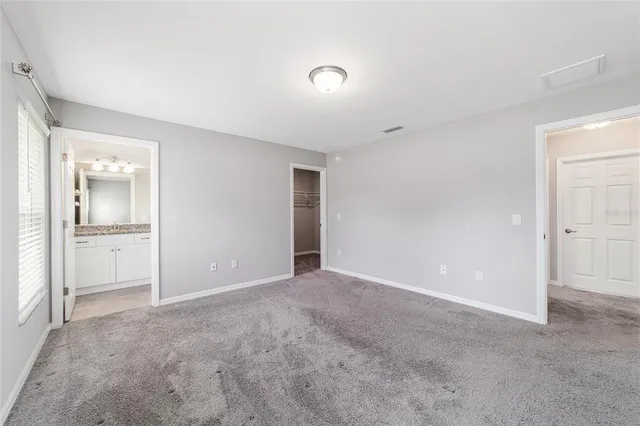 a view of an empty room and fire place