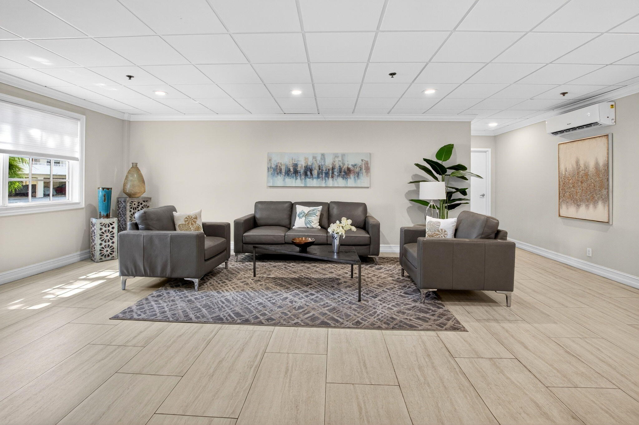 950 De Soto Road, Unit 5A Boca Raton, FL 33432 - Photo 65 of 98 a living room with furniture and a rug