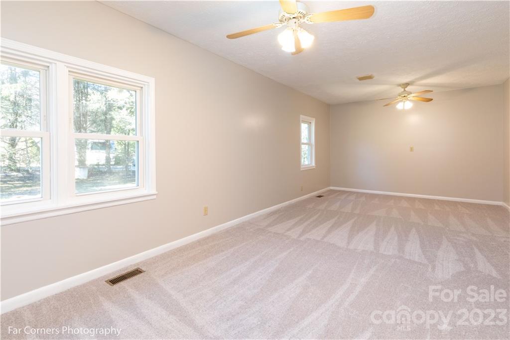 8 Ross Farm Road Waynesville, NC 28786 - Photo 12 of 23 an empty room with windows and fan