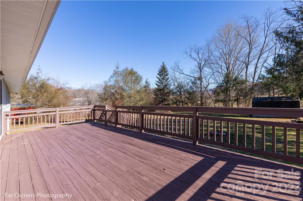8 Ross Farm Road Waynesville, NC 28786 - Photo 15 of 23 a view of deck with wooden floor and trees