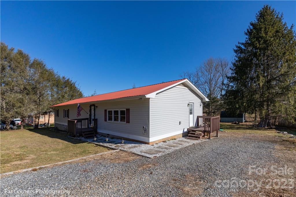 8 Ross Farm Road Waynesville, NC 28786 - Photo 3 of 23 a view of a house with a backyard