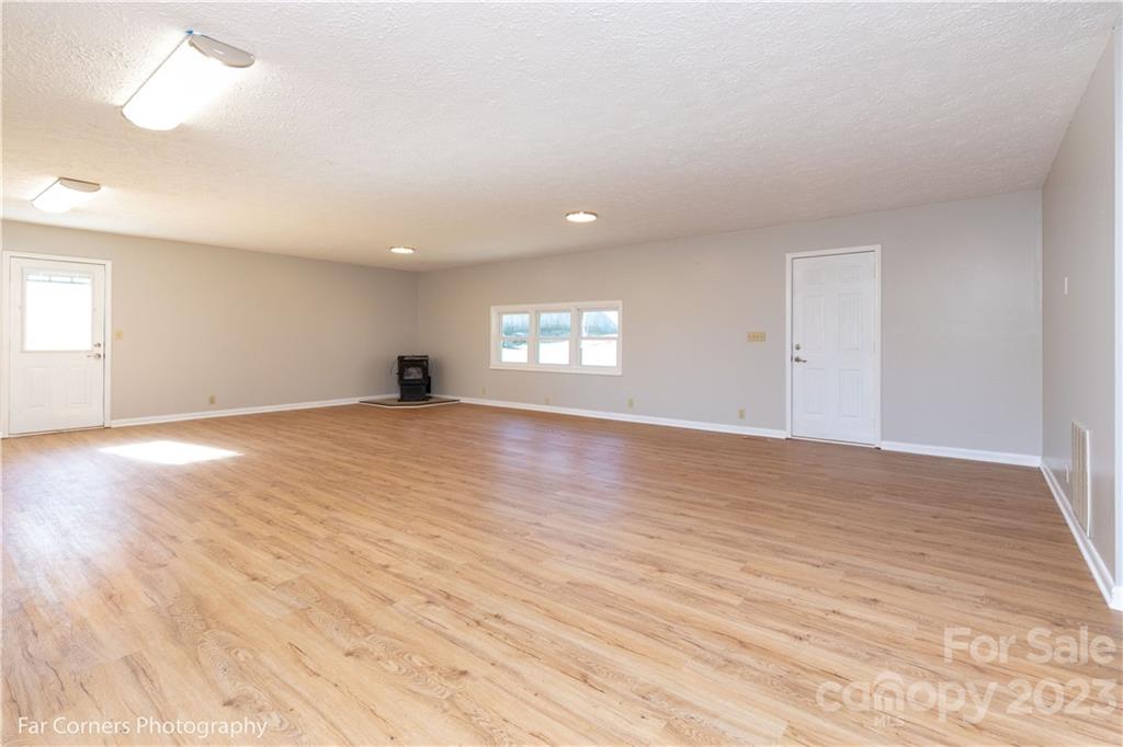 8 Ross Farm Road Waynesville, NC 28786 - Photo 5 of 23 wooden floor in an empty room with a window
