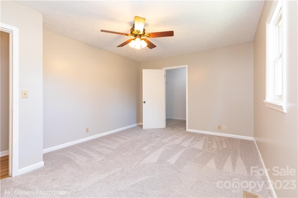 8 Ross Farm Road Waynesville, NC 28786 - Photo 10 of 23 an empty room with closet and windows