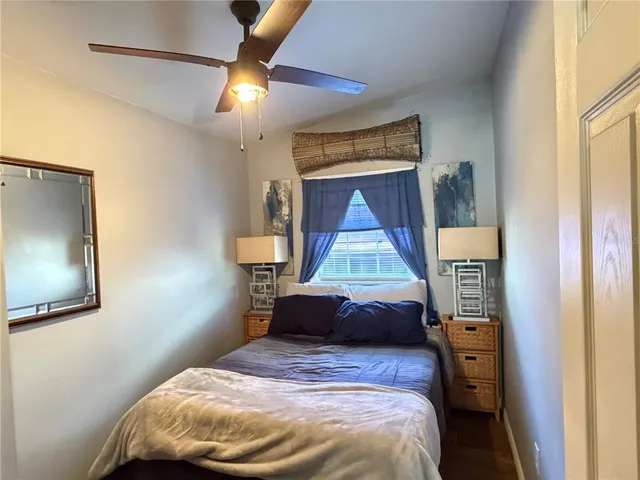 a bedroom with a bed and a mirror