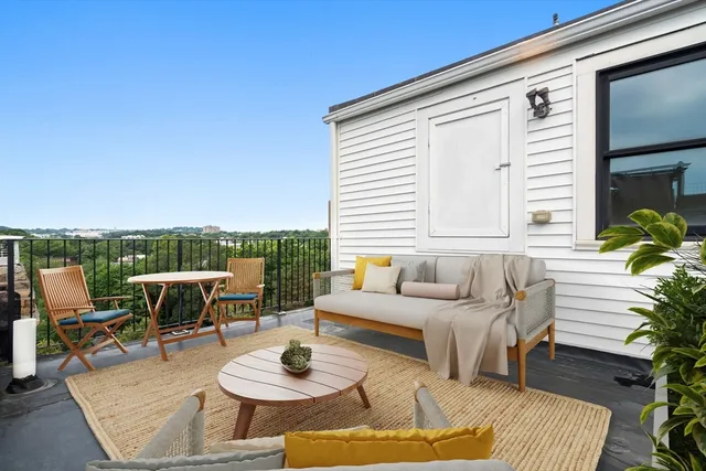 a outdoor space with patio the couches and a potted plant on the table