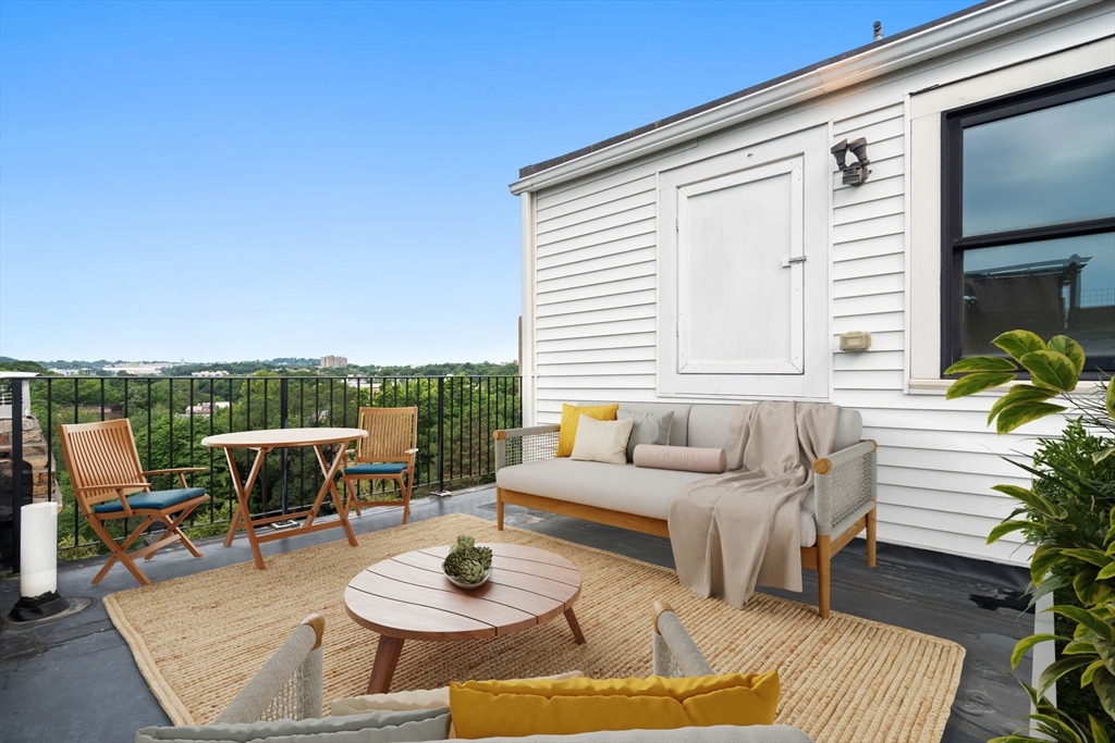324 Tappan Street, Unit 2 Brookline, MA 02445 - Photo 15 of 19 a outdoor space with patio the couches and a potted plant on the table