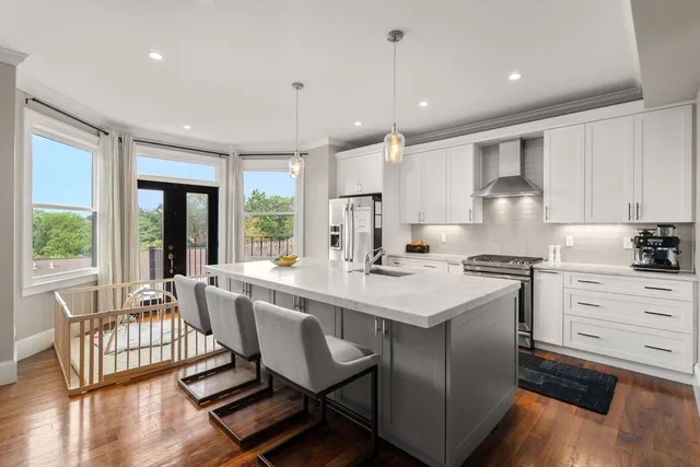 a kitchen with counter space sink and appliances