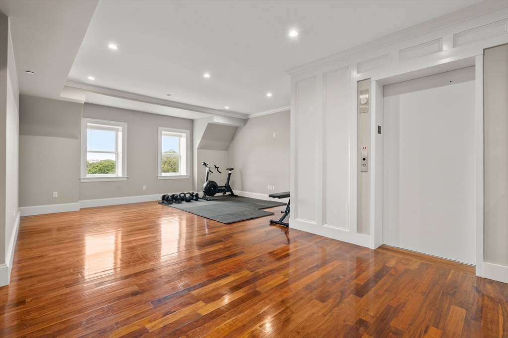 324 Tappan Street, Unit 2 Brookline, MA 02445 - Photo 7 of 19 a view of a room with wooden floor and pool table