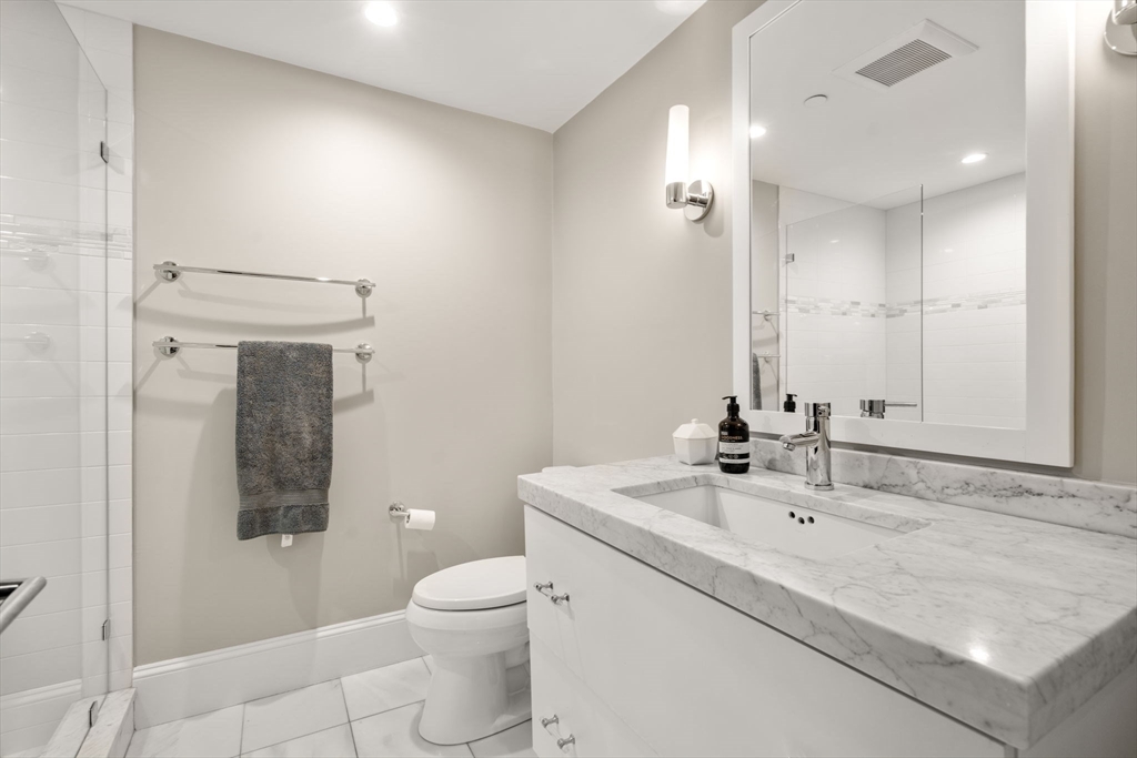 324 Tappan Street, Unit 2 Brookline, MA 02445 - Photo 10 of 19 a bathroom with a sink a toilet and shower