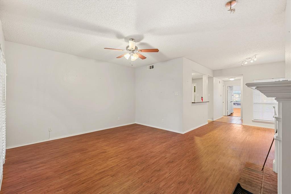 12660 Hillcrest Road, Unit 7103 Dallas, TX 75230 - Photo 5 of 14 a view of an empty room with a kitchen