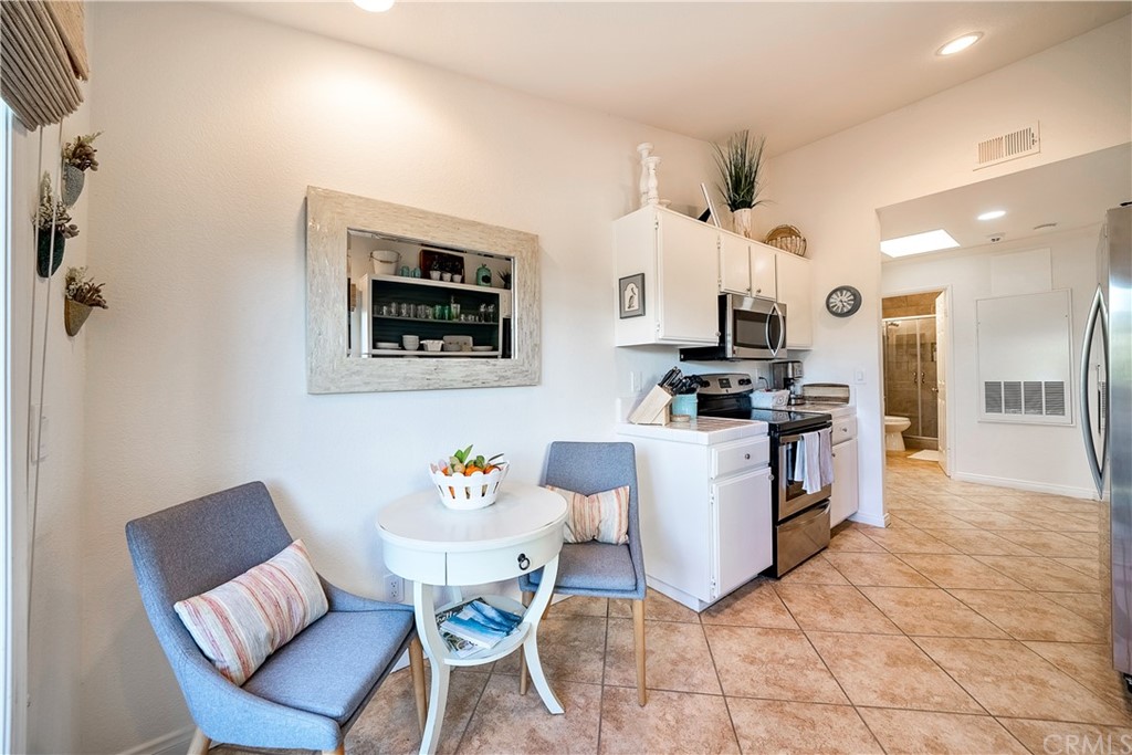 26 Corniche Drive, Unit F Dana Point, CA 92629 - Photo 14 of 46 a living room with furniture and kitchen view
