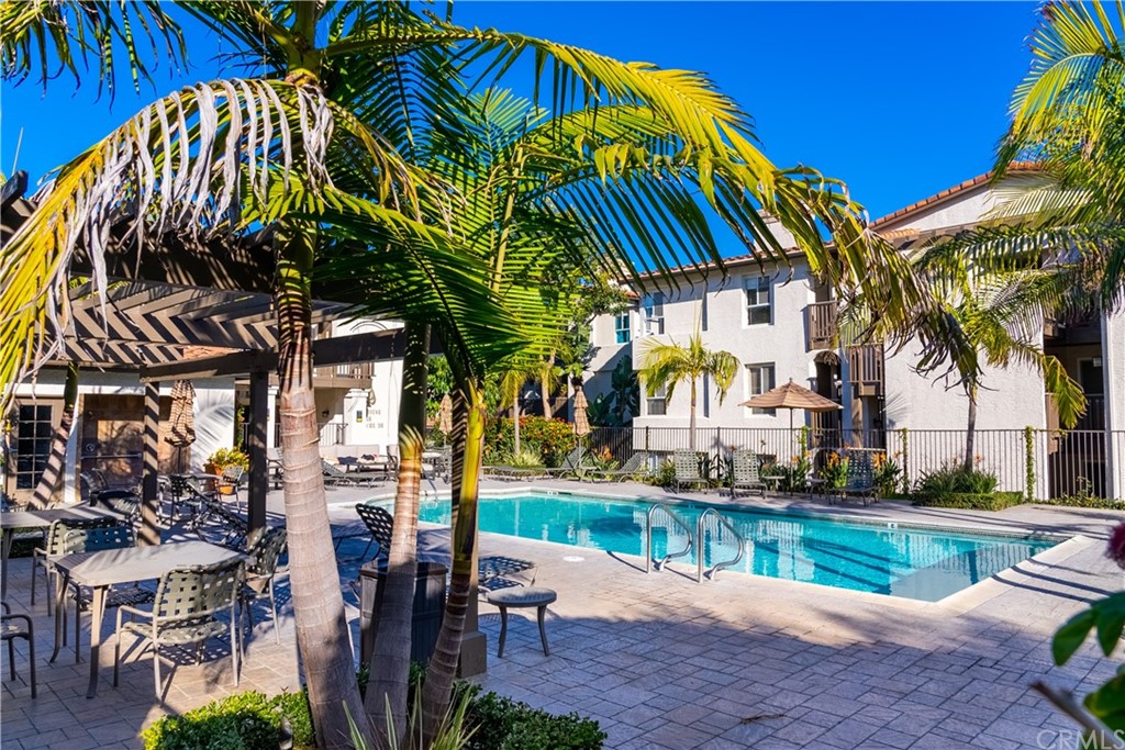 26 Corniche Drive, Unit F Dana Point, CA 92629 - Photo 20 of 46 a view of backyard with swimming pool and outdoor seating
