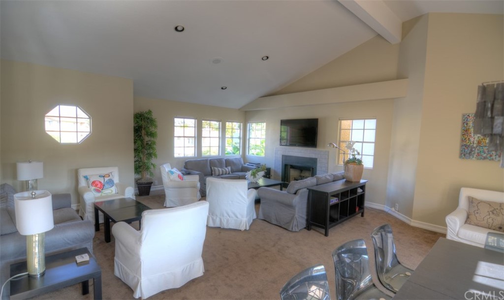 26 Corniche Drive, Unit F Dana Point, CA 92629 - Photo 21 of 46 a living room with furniture and a wooden floor