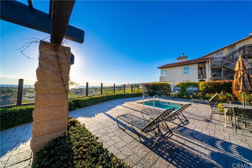 26 Corniche Drive, Unit F Dana Point, CA 92629 - Photo 27 of 46 a view of a patio with chairs and potted plants