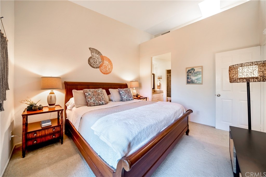 26 Corniche Drive, Unit F Dana Point, CA 92629 - Photo 29 of 46 a bedroom with a bed and window