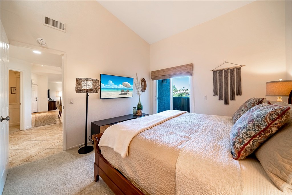 26 Corniche Drive, Unit F Dana Point, CA 92629 - Photo 30 of 46 a bed room with a bed and a large mirror