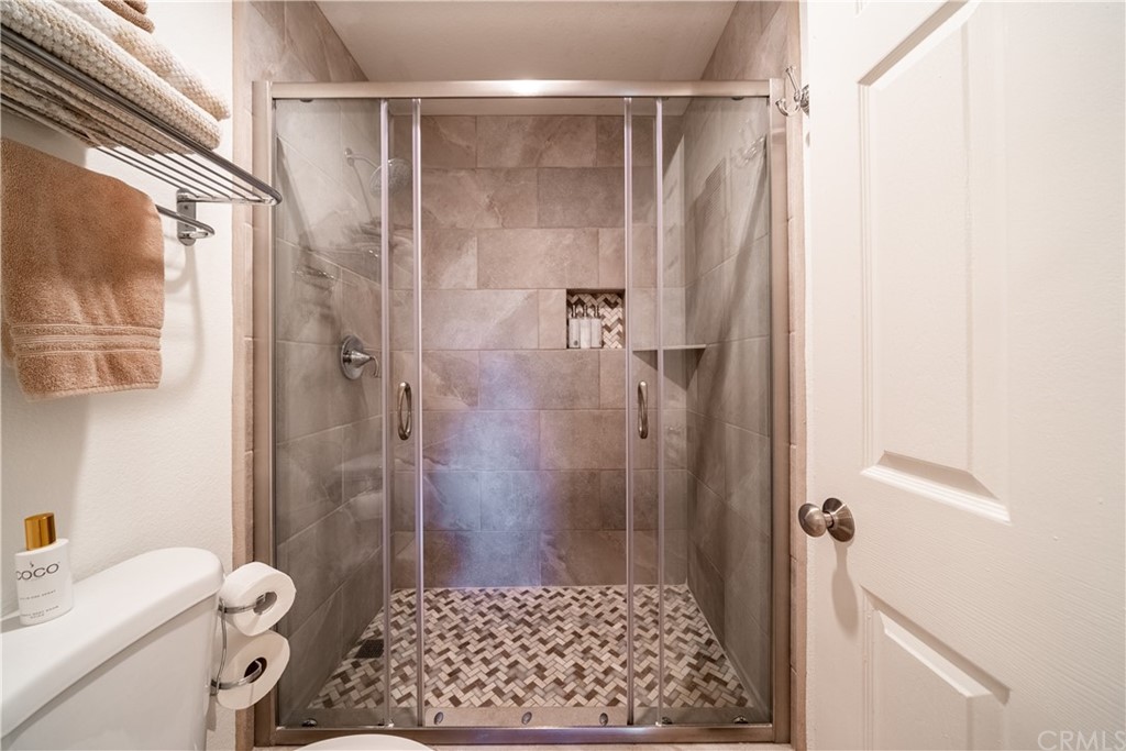 26 Corniche Drive, Unit F Dana Point, CA 92629 - Photo 35 of 46 a bathroom with a shower and a toilet