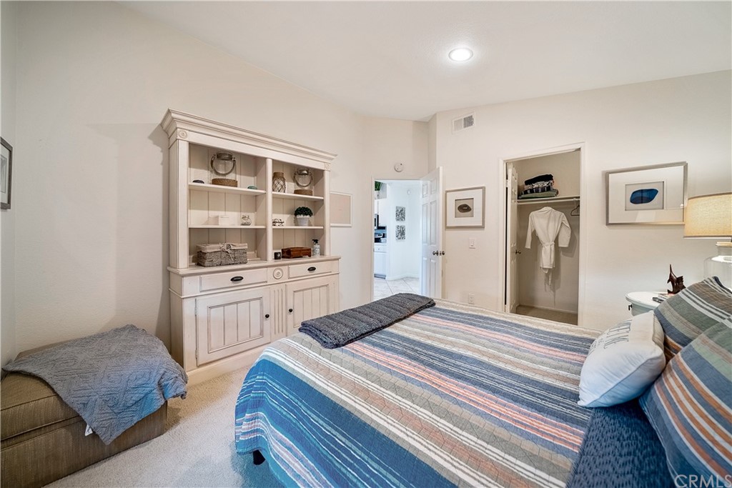26 Corniche Drive, Unit F Dana Point, CA 92629 - Photo 36 of 46 a bedroom with a bed and a dresser
