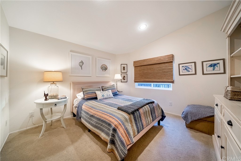 26 Corniche Drive, Unit F Dana Point, CA 92629 - Photo 37 of 46 a bedroom with a bed and a dresser with rug