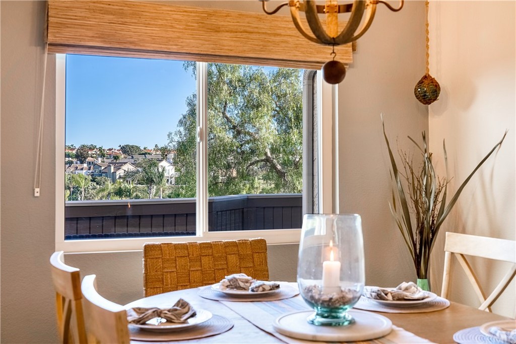 26 Corniche Drive, Unit F Dana Point, CA 92629 - Photo 5 of 46 a view of a living room with a floor to ceiling window and tree