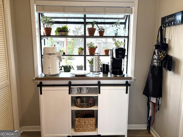 a living room with a couch and a potted plant