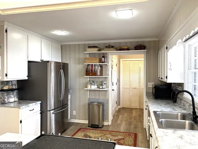 a bedroom with a bed and dresser