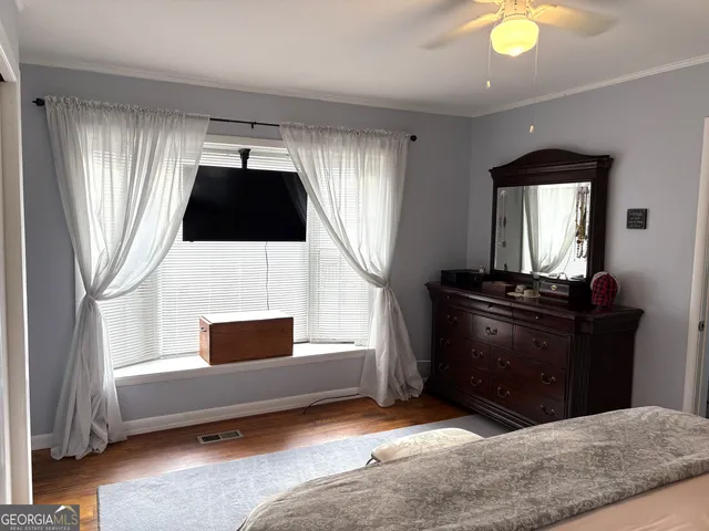 a bathroom with a toilet a sink and a mirror
