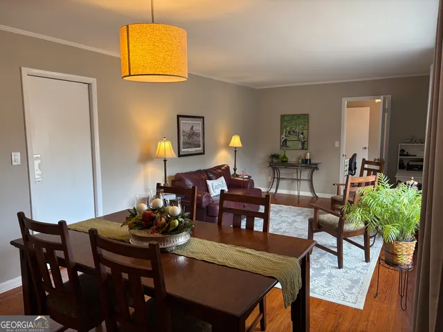 a kitchen with stainless steel appliances a stove a sink and a refrigerator