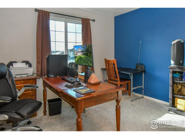 a view of a workspace with furniture