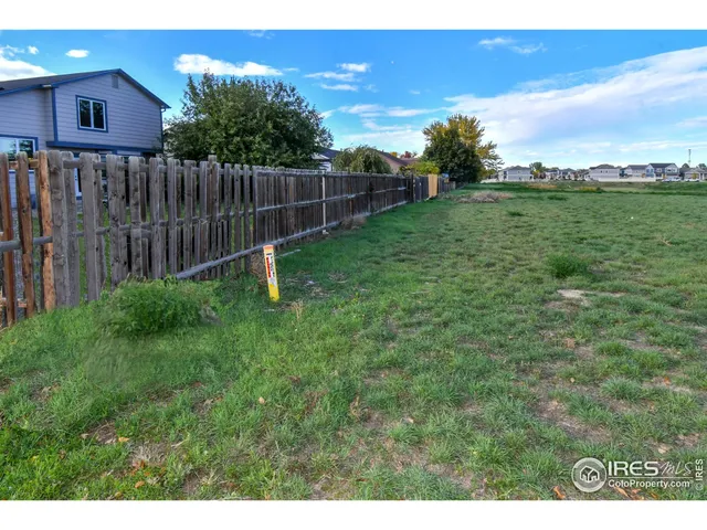a garden with wooden fence