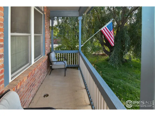 a view of a two chairs in the balcony