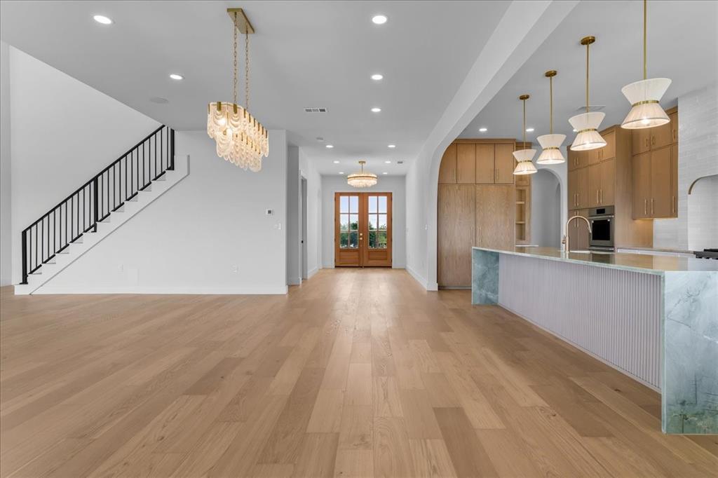 10576 Buccaneer Point Frisco, TX 75036 - Photo 6 of 40 a view of a big room with wooden floor and windows