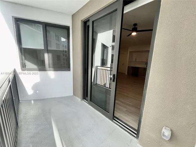 a room with pool table and window