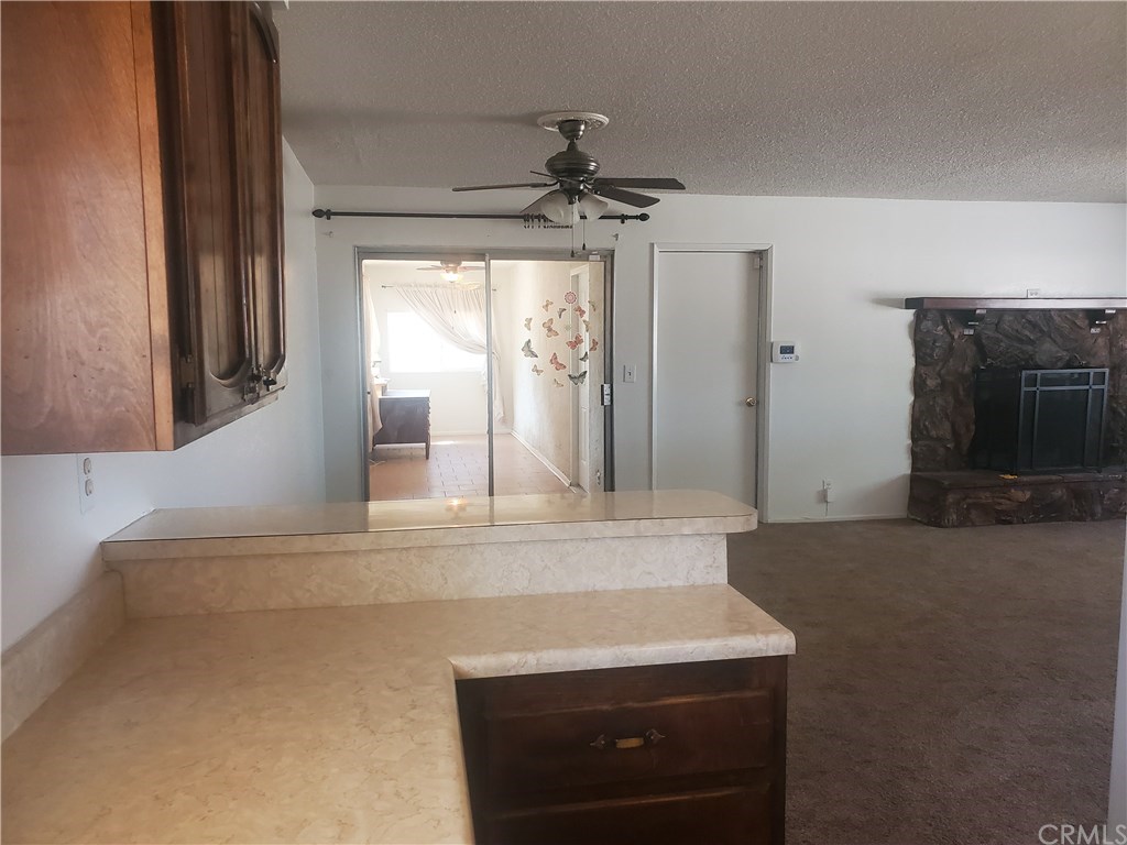 13020 Pawnee Road Apple Valley, CA 92308 - Photo 13 of 14 Kitchen to dining room, enclosed patio, living room
