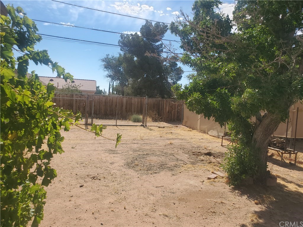 13020 Pawnee Road Apple Valley, CA 92308 - Photo 4 of 14 RV parking back yard. Fully fenced chain link