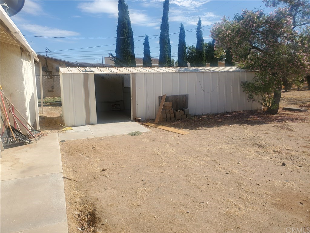13020 Pawnee Road Apple Valley, CA 92308 - Photo 6 of 14 Long metal shed back yard