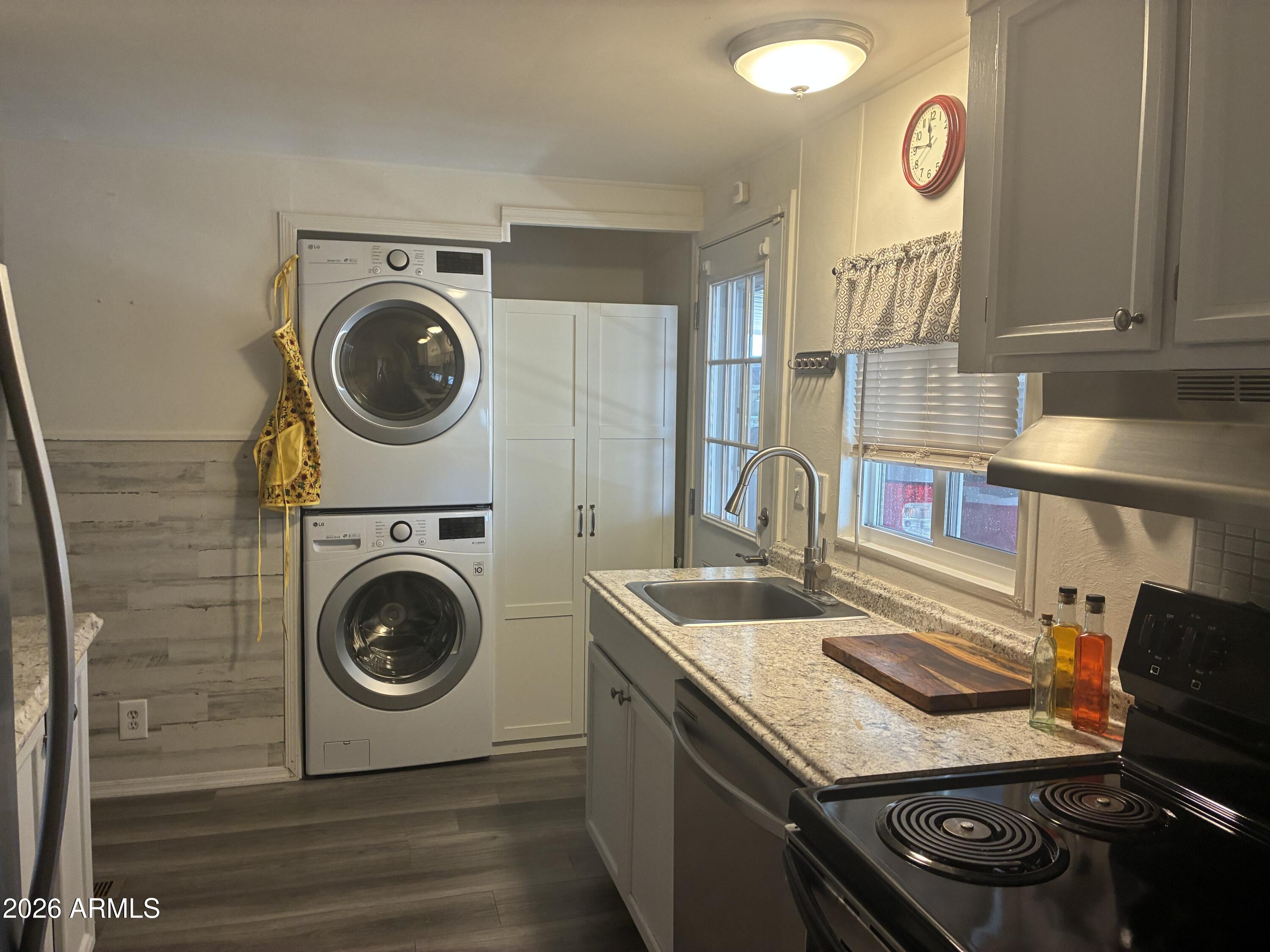 53 North Mountain Road, Unit 58 Apache Junction, AZ 85120 - Photo 16 of 39 a utility room with sink dryer and washer