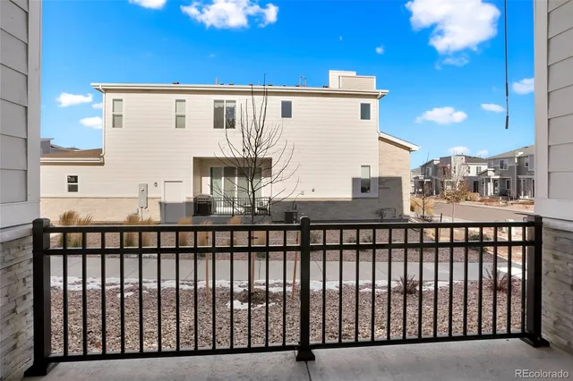 a view of a brick house with a large window